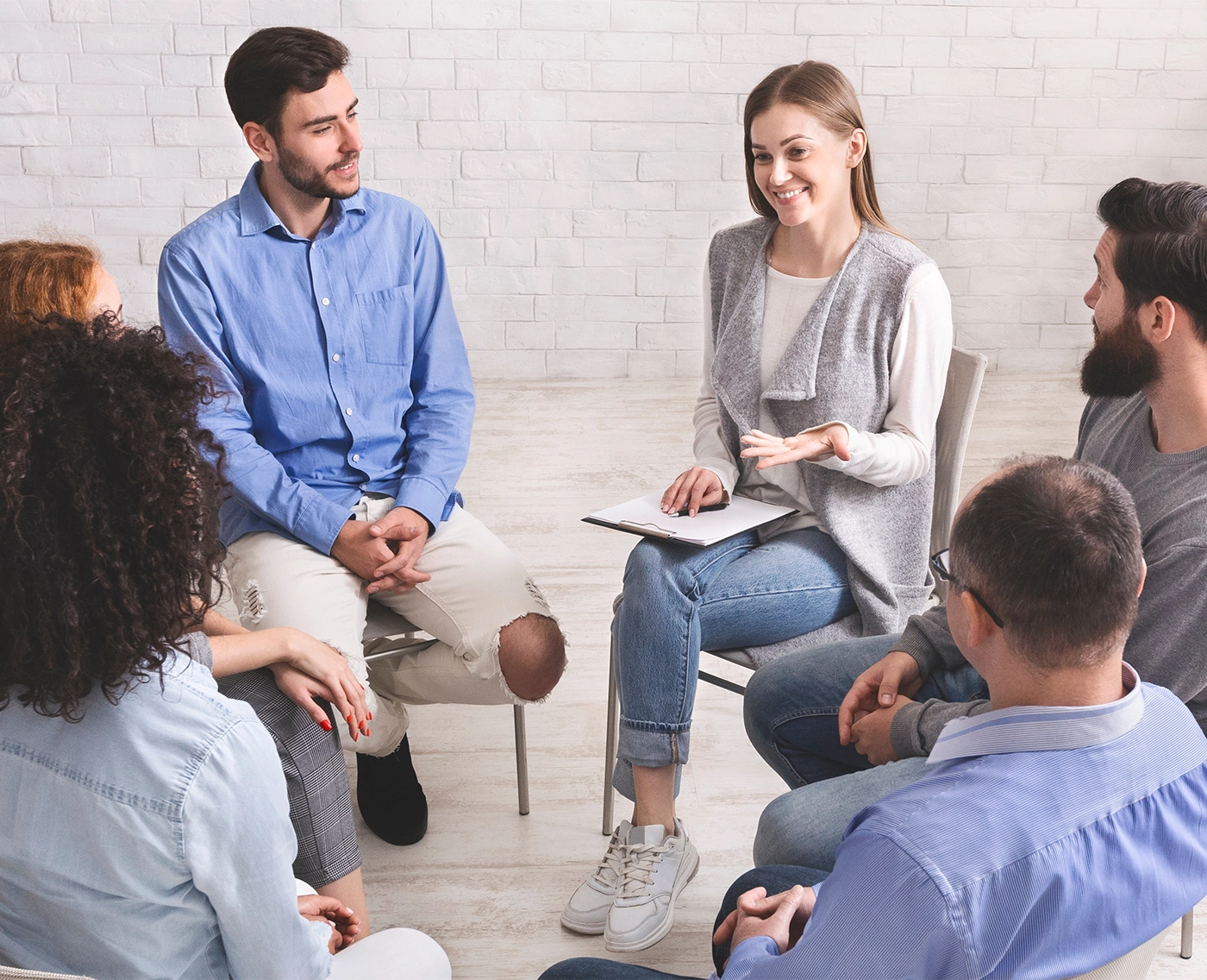 First rehab meeting. Psychotherapist talking with patients of support group
