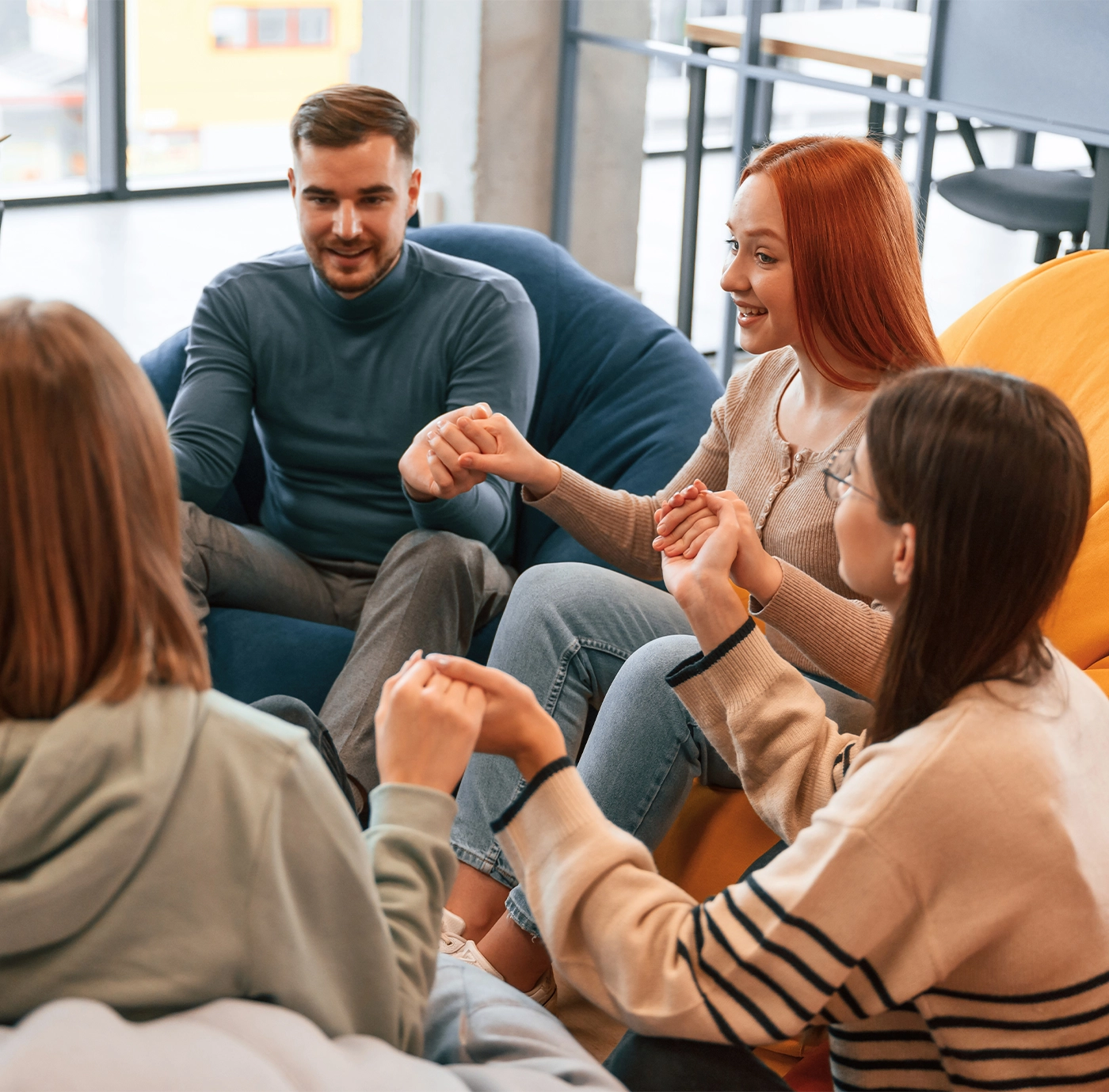 Talking, helping each other. Group of people are having therapy meeting together.