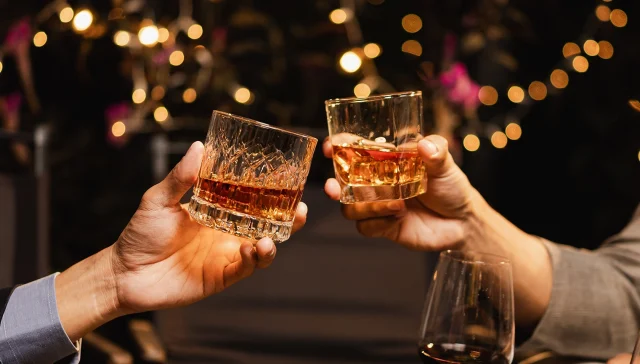 Happy two man clinking glasses of whiskey in celebration, Holiday, Festival celebration.