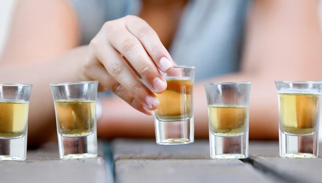 Young and alcohol. Alcohol addiction and binge drinking concept.