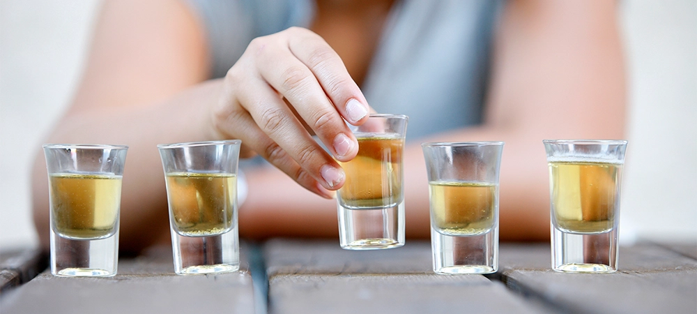 Young and alcohol. Alcohol addiction and binge drinking concept.