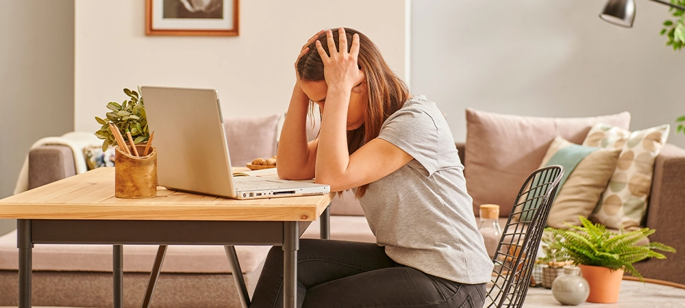 Boring and nervous woman working at the office, laptop study table style.